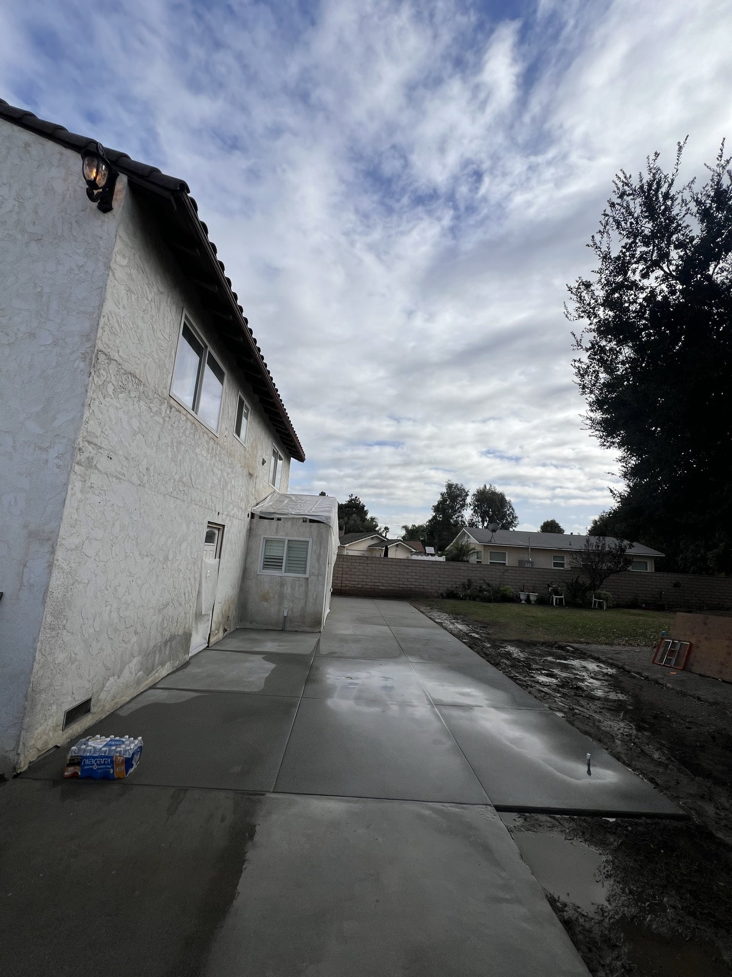Finished concrete slab under an open Southern California sky