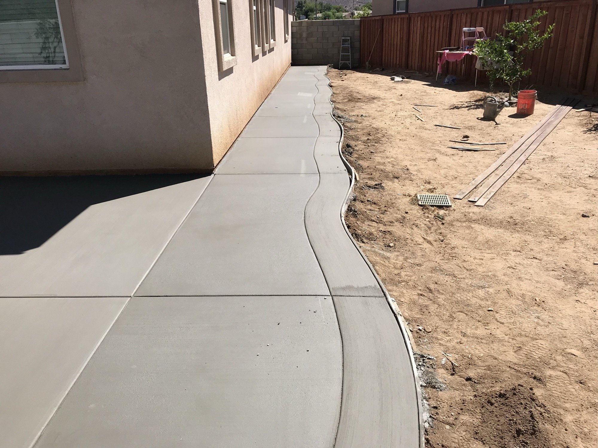Long sidewalk slab pour next to a home